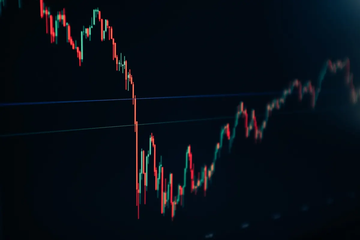 Trader reviewing a price chart with indicator signals
